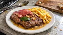 Bifes de vaca à portuguesa: dourados com alho, louro e um molho rápido de vinho branco